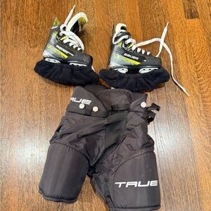Boys 9c Bauer Hockey Skates and True Padded Shorts.